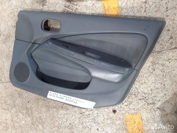 Обшивка двери nissan almera classic
