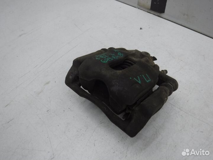 Суппорт тормозной передний левый Nissan Almera 201