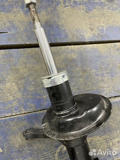 Стойка амортизатора передняя левая калина