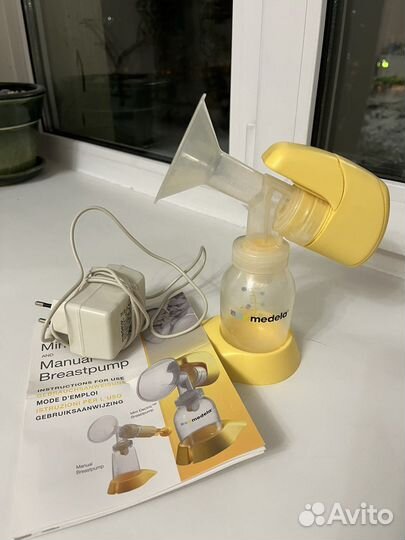 Молокоотсос medela электрический