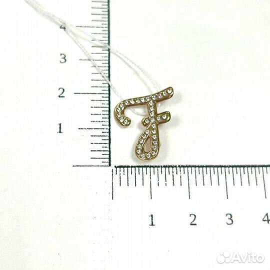 Золотая брошь с камнем