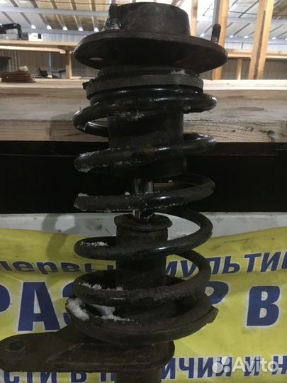 Стойка амортизатора переднего правого Chevrolet La