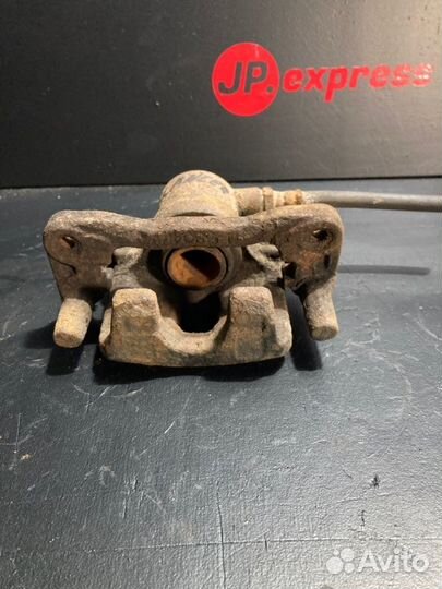 Суппорт тормозной задний левый Mitsubishi Lancer 9