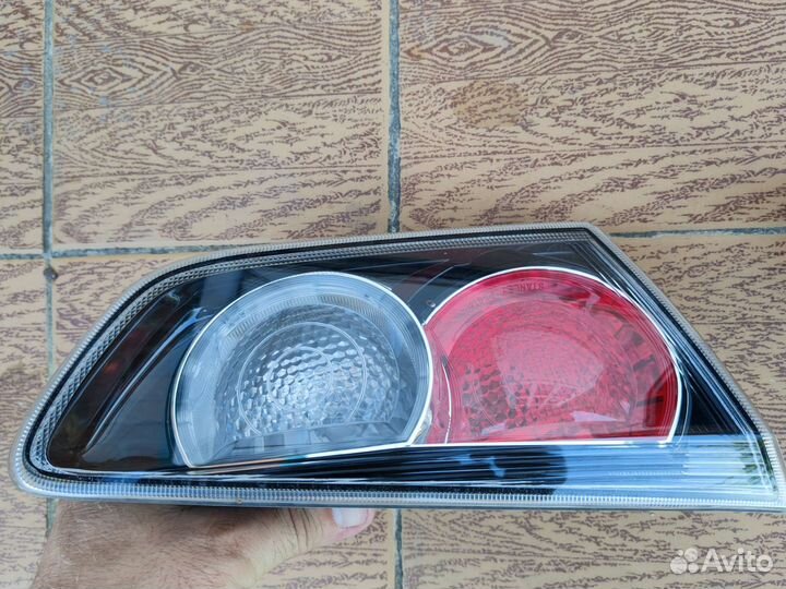 Фонарь крышки багажника lancer 10