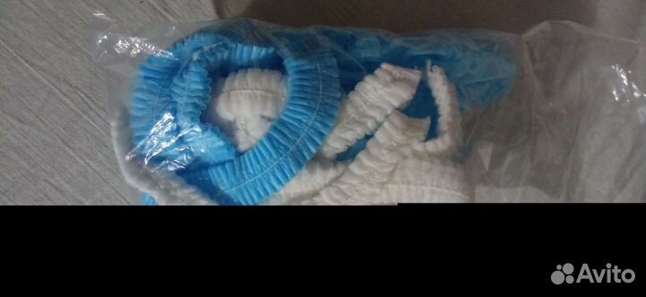 Простыни шапочки халаты одноразовые нетканый матер