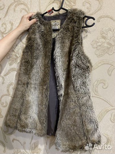 Жилетки меховые женские
