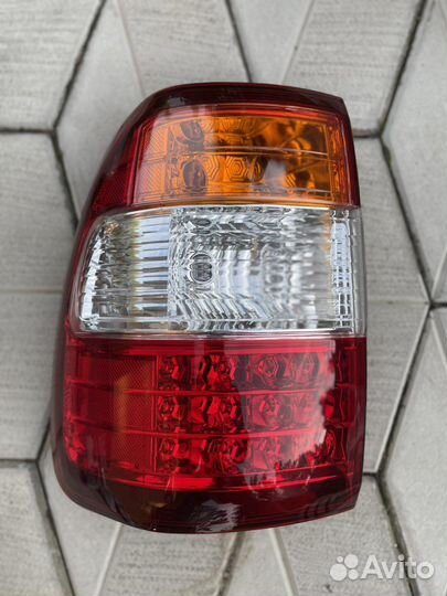 Новый Фонарь задний Toyota Land Cruiser 100