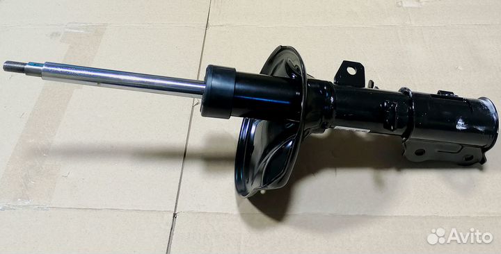 Амортизатор передний левый Церато Kia Cerato