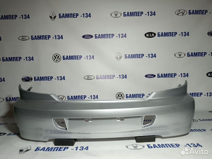 Бампер задний kia spectra серебристый