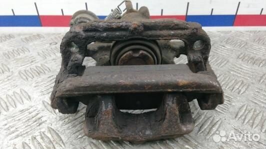 Суппорт тормозной задний левый opel astra J (LEA12