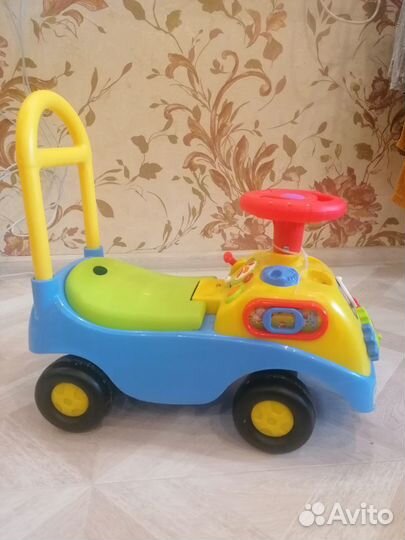 Машинка каталка музыкальная