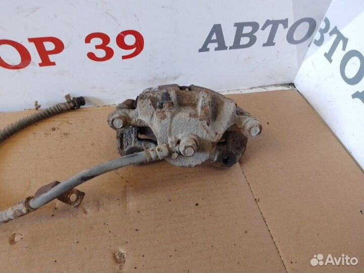 Суппорт тормозной передний левый Hyundai Matrix