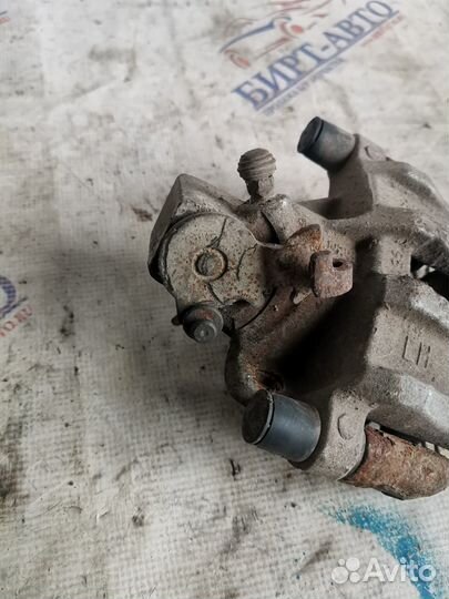 Суппорт тормозной задний левый Ford Focus II реста