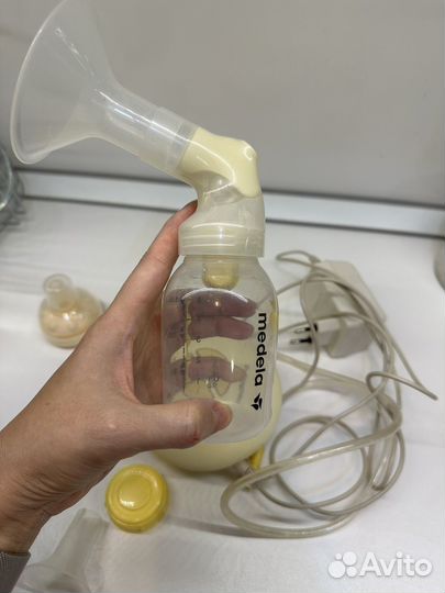Молокоотсос medela электрический