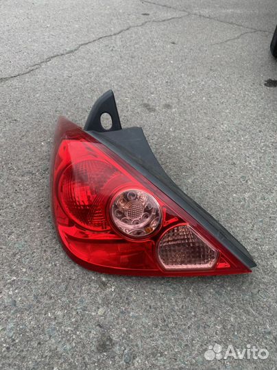 Фонарь заднего хода nissan tiida левая