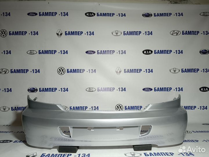 Бампер задний kia spectra серебристый