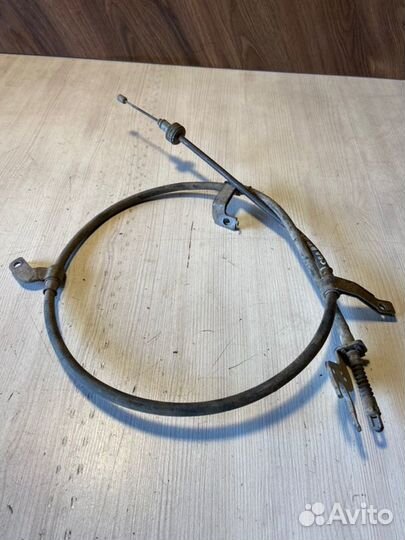 Трос стояночного тормоза левый Hyundai Solaris