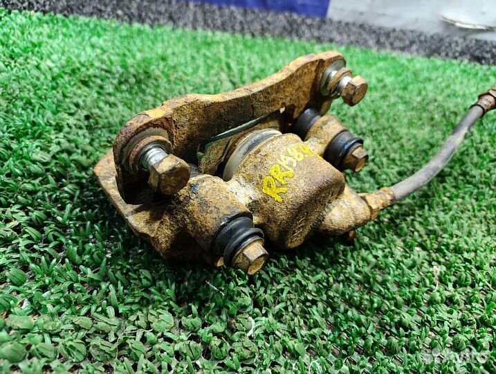 Суппорт тормозной задний правый Mitsubishi Pajero Sport