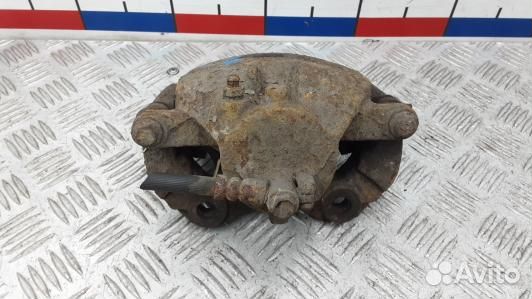 Суппорт тормозной передний левый nissan primera P1