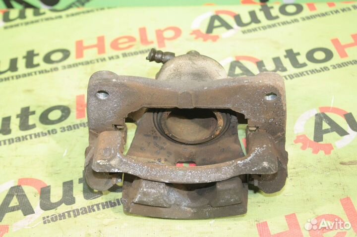 Суппорт toyota ractis SCP100 2SZ-FE 22VL перед лев