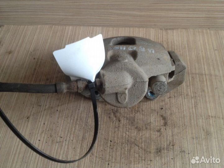 Суппорт тормозной передний левый Ford Fiesta MK V