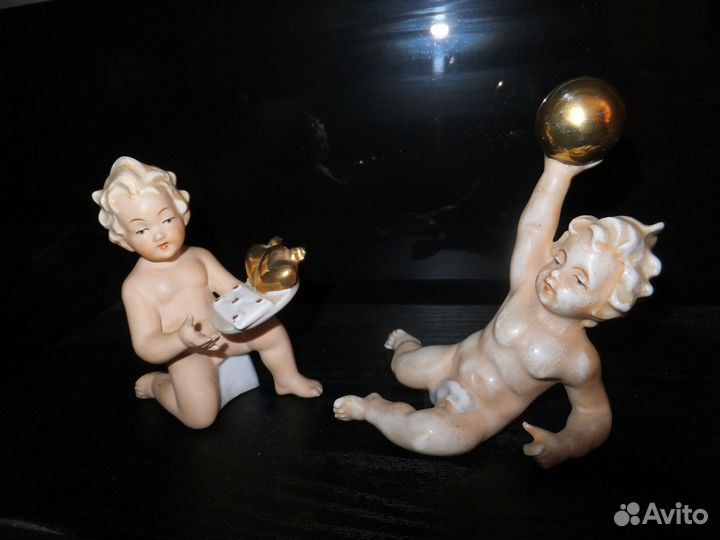 Фарфоровая статуэтка- Путти. N 9823