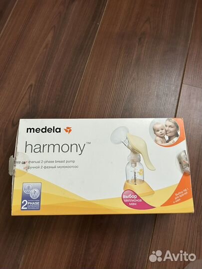 Ручной молокоотсос medela и детские бутылочки