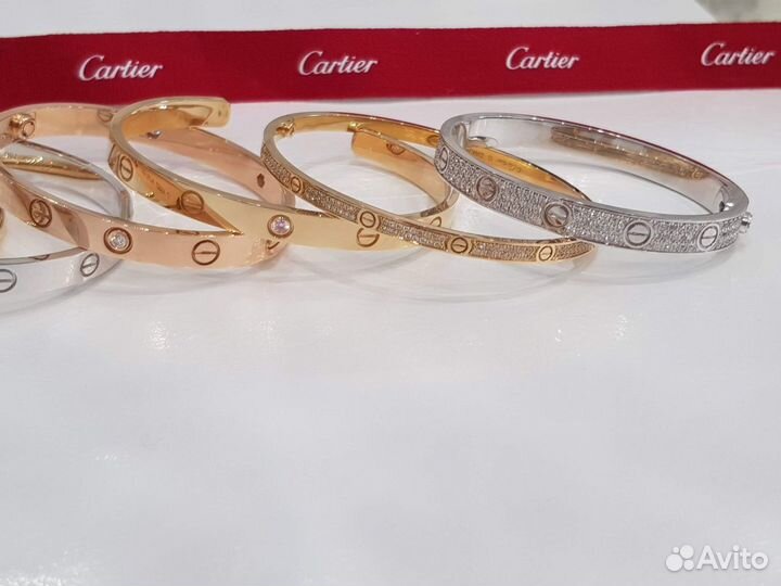 Золотые браслеты Cartier Love и Just un clou с бри