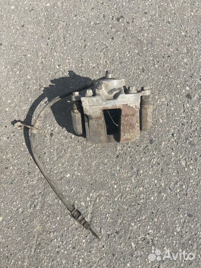 Суппорт тормозной передний левый Kia Optima 3