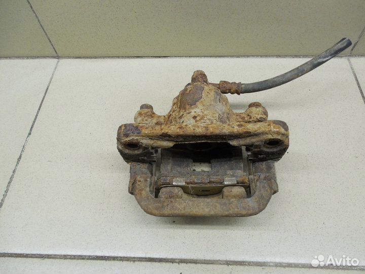 Суппорт задний левый X-Trail (T30) 2001-2006