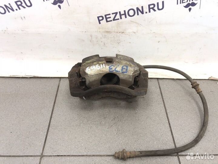 Суппорт тормозной передний левый Nissan Qashqai