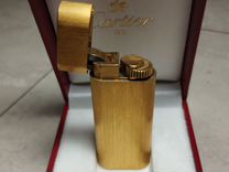 Золотая зажигалка Cartier