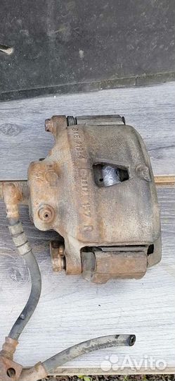 Суппорт тормозной Nissan Primera P10