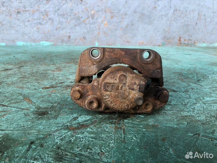 Суппорт тормозной передний левый Renault Logan