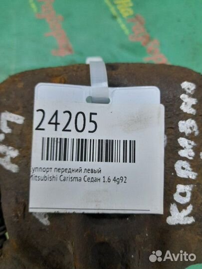 Суппорт передний левый Mitsubishi Carisma седан