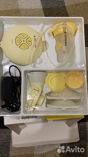 Молокоотсос medela электрический