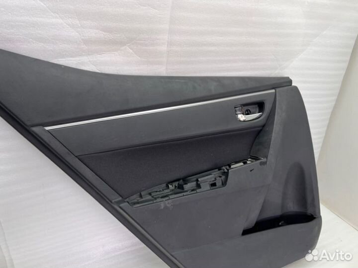 Обшивка двери задняя левая Toyota Coroiia