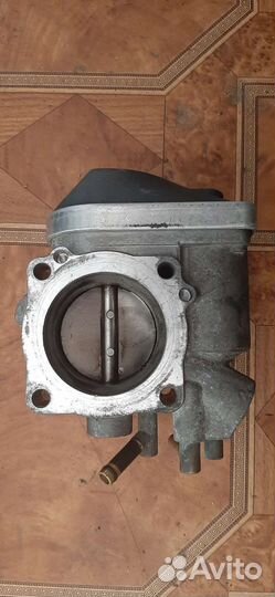Дроссельная заслонка Volkswagen Golf 06a133062at