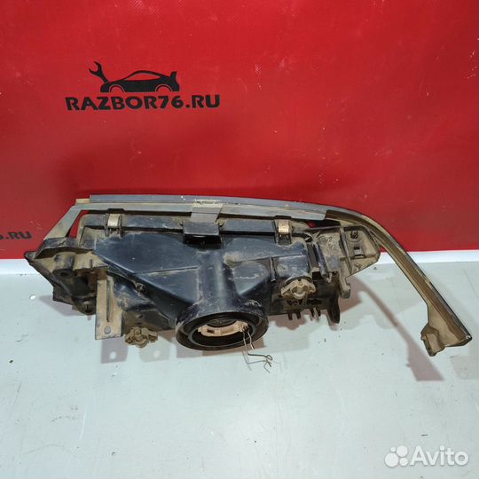 Фара левая Mazda 323 BG седан