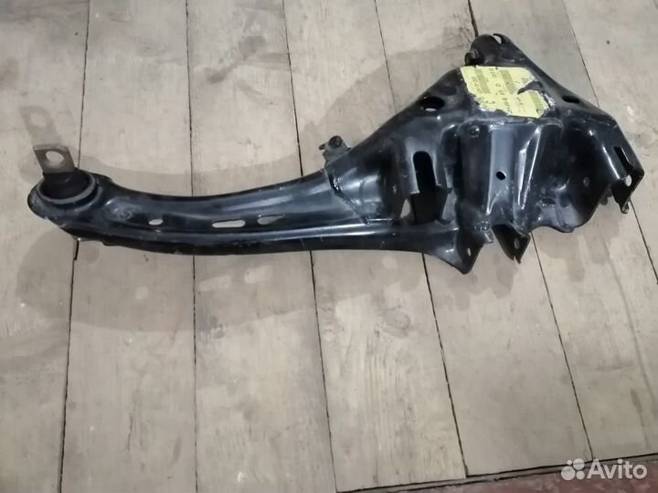 Рычаг продольный левый задней подвески