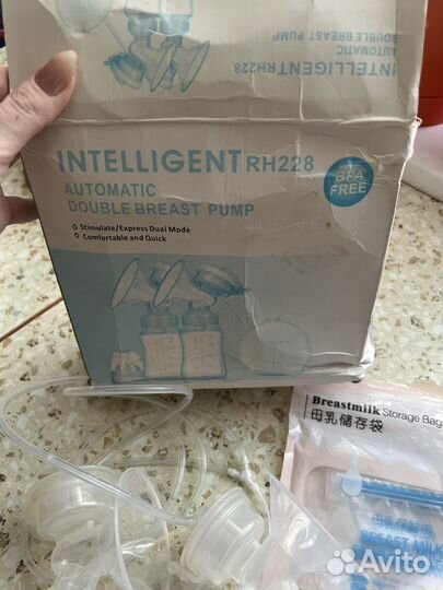 Электронный молокоотсос