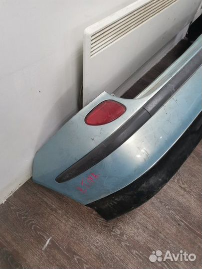 Бампер задний Nissan Tino