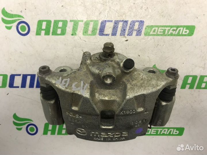 Суппорт тормозной передний левый Mazda 3 BP PE