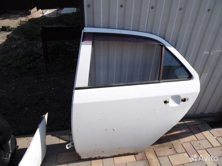 Дверь задняя левая Geely Mk 2010