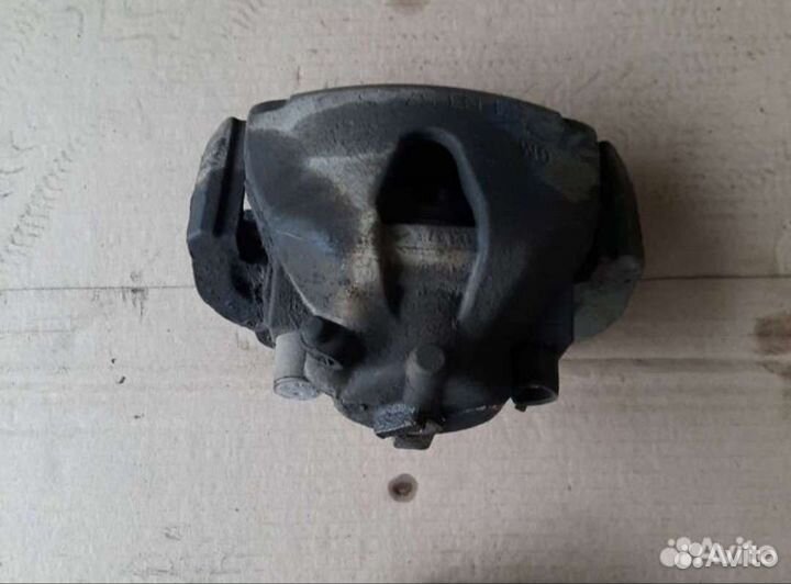 Суппорт тормозной Опель Астра Н