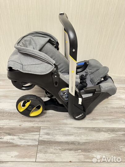Коляска автокресло Doona с базой isofix