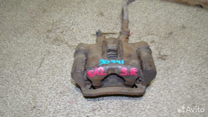 Суппорт задний правый Toyota Corolla (E120)