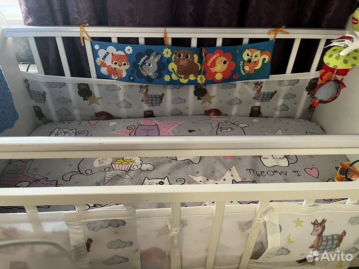 Детская кроватка с поперечным маятником