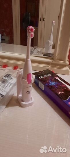 Электрическая зубная щетка