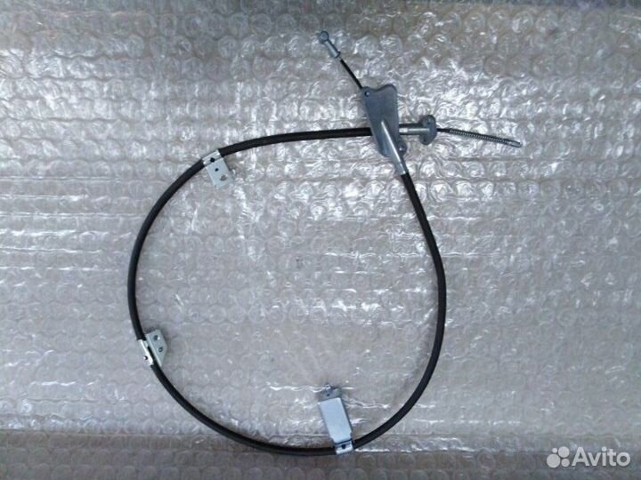 Трос стояночного тормоза задний левый Nissan